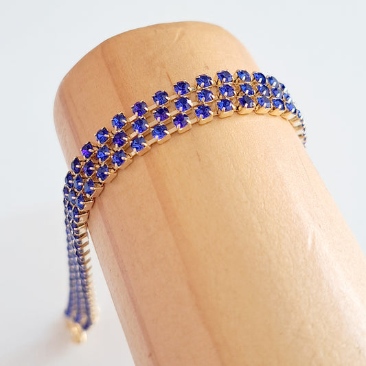 Pulseira dourada tripla strass azul royal